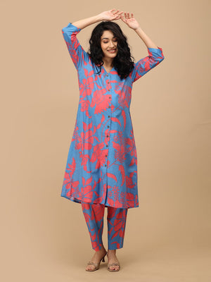 Model wearing blue and coral maternity and nursing co-ord set styled for pregnancy and postpartum wear.
