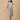 Model walking in a mint floral maternity and nursing kurta set, showcasing flowy fabric and easy movement.