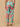 Back view of mint green floral maternity pants with elastic waist for a flexible fit.