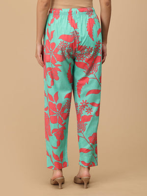 Back view of mint green floral maternity pants with elastic waist for a flexible fit.