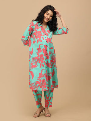 Front view of model in mint green floral maternity kurta set, showing comfortable silhouette and three-quarter sleeves.