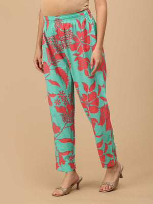 Side view of mint green floral maternity pants with soft elasticated waistband for comfort.