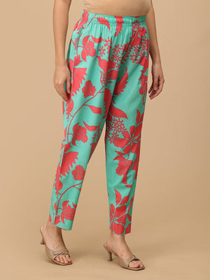Side view of mint green floral maternity pants with soft elasticated waistband for comfort.