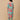 Back view of mint green floral maternity kurta with gathered yoke and all-over coral floral print.