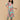 Model wearing a mint green floral maternity and nursing kurta with matching pants, featuring coral floral prints and a V-neck button-down front.