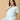 Smiling mom-to-be in The Mom Store Frosted Fluff maternity pajama set, soft cotton comfort nightwear.