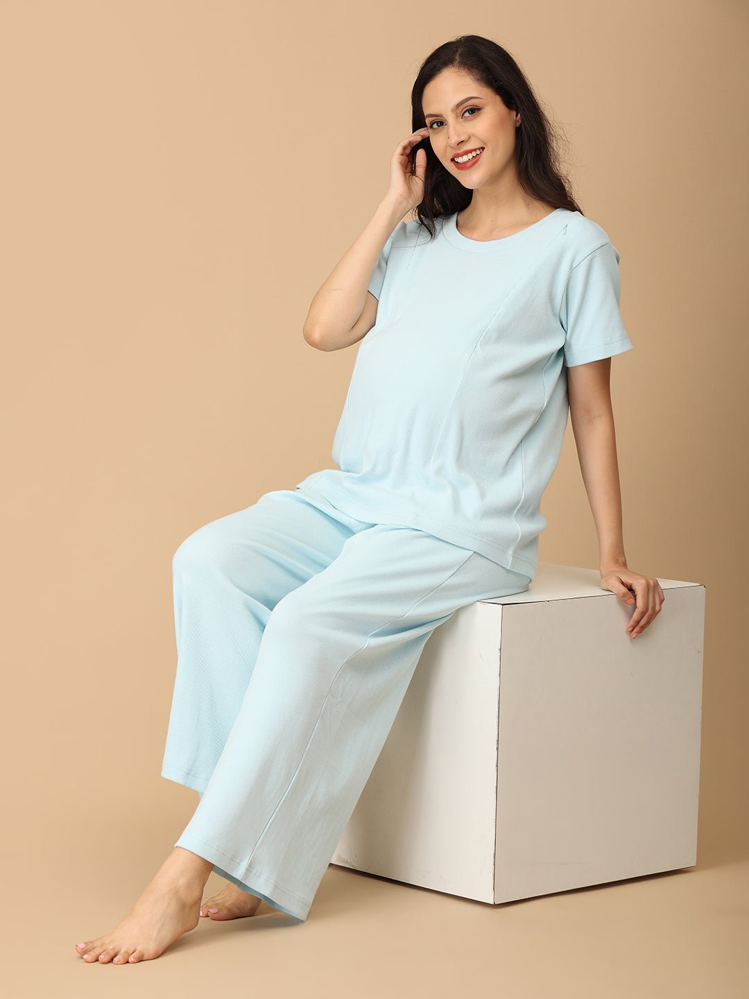 Pregnant woman wearing The Mom Store Frosted Fluff maternity and nursing nightwear set in pastel blue, comfortable loungewear.