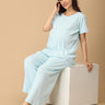 Pregnant woman wearing The Mom Store Frosted Fluff maternity and nursing nightwear set in pastel blue, comfortable loungewear.