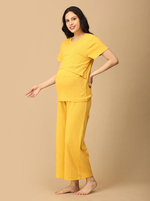 Pregnant Model wearing Golden Glow-Up Maternity and Nursing Nightwear Set from the mom store posing sideways
