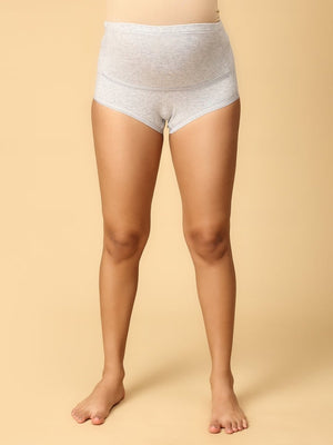 Model wearing grey coloured over the belly support panties from the mom store