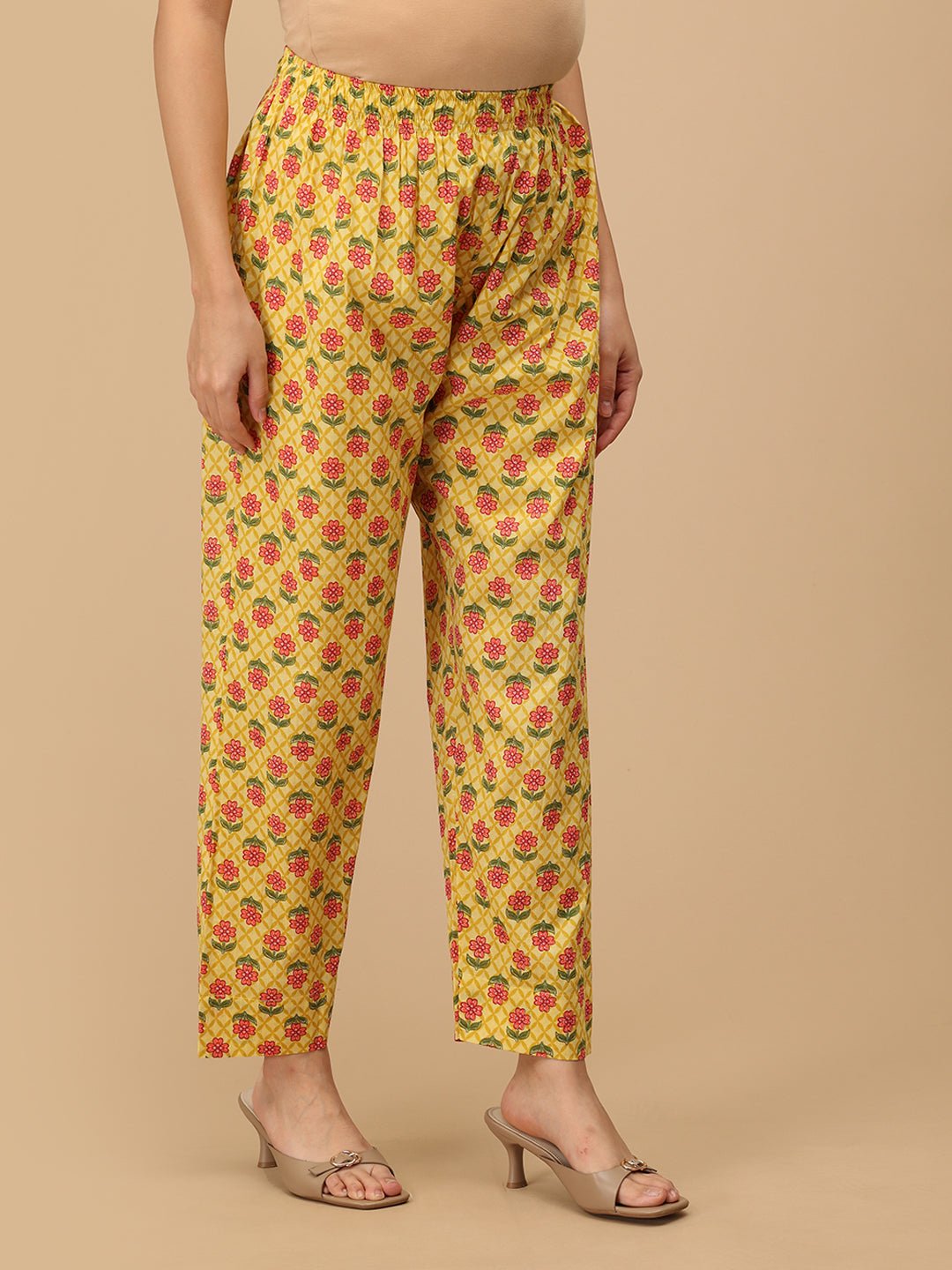 Comfort-fit floral maternity pants in yellow from The Mom Store, side view