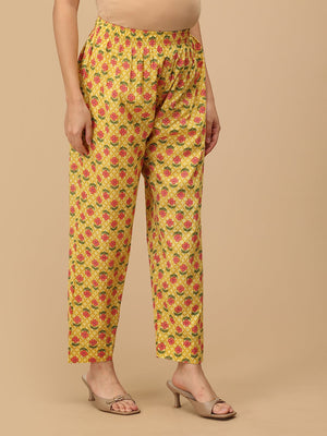 Comfort-fit floral maternity pants in yellow from The Mom Store, side view