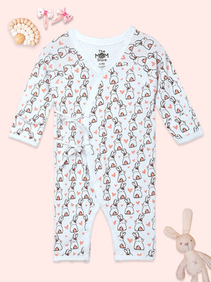 Picture of a jabla style romper with rabbit designs kept on a pink background from the mom store