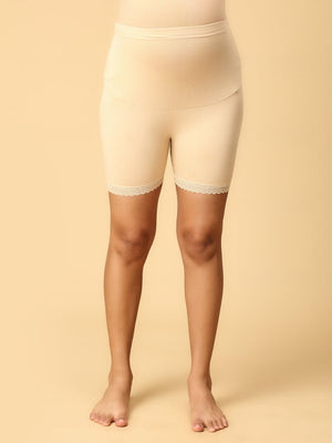 Model wearing beige coloured high waisted mama boyshorts from the mom store