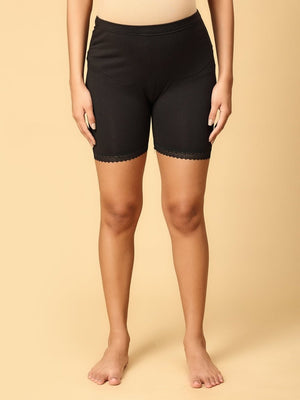 Model wearing black coloured over the belly support panties from the mom store