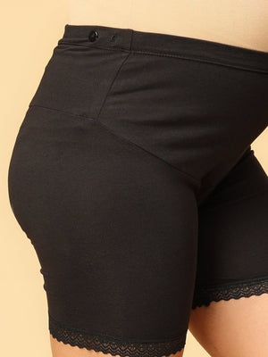 Close up of black coloured over the belly support panties from the mom store showing adjustible bands
