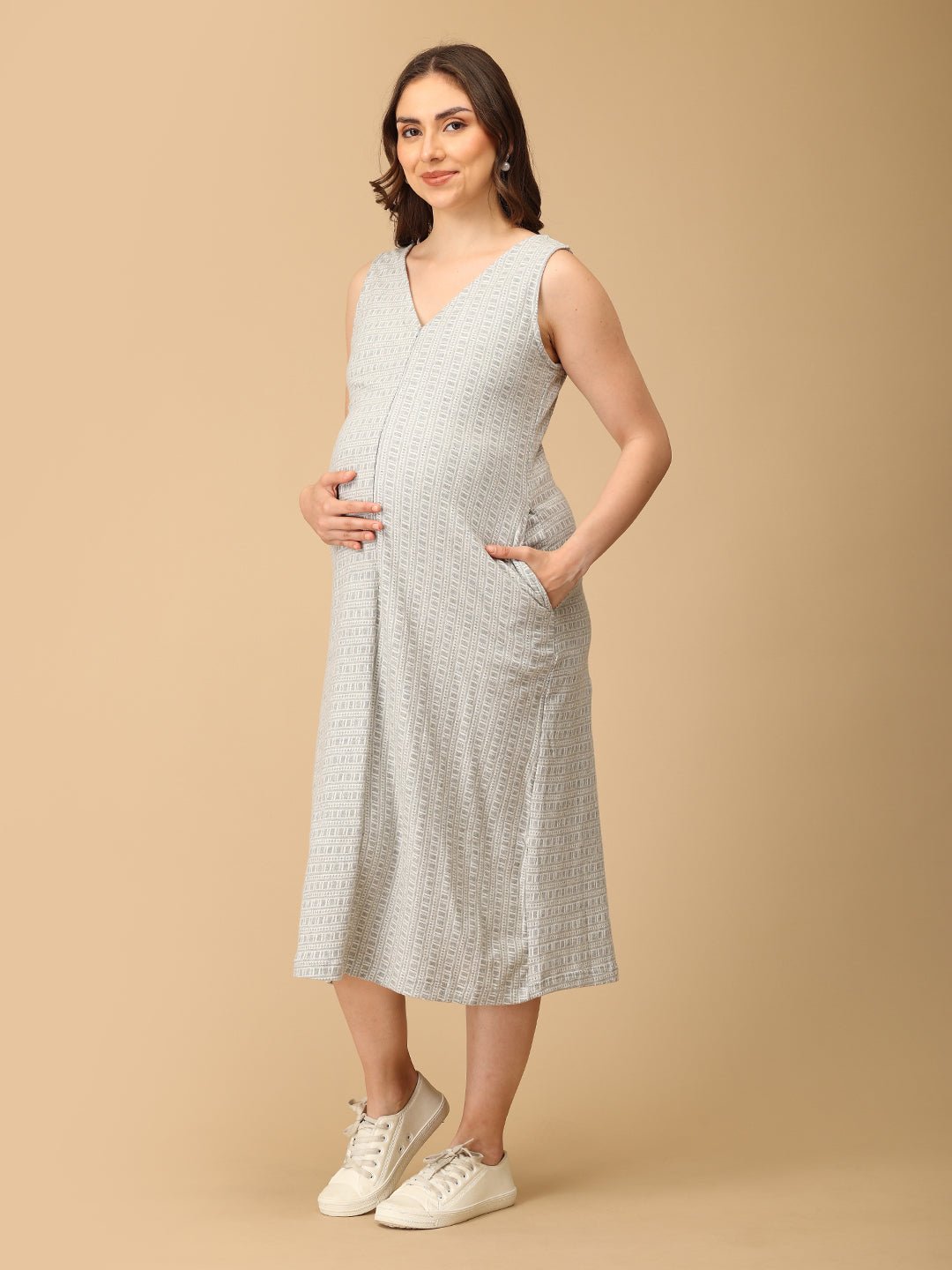 Elegant maternity and nursing dress with shrug in soft grey pattern, designed for pregnant and breastfeeding moms. Made from breathable fabric with hidden zipper for easy nursing access, side pockets, and detachable shrug. Perfect for maternity wear India, feeding dresses online, and everyday comfort with effortless style.