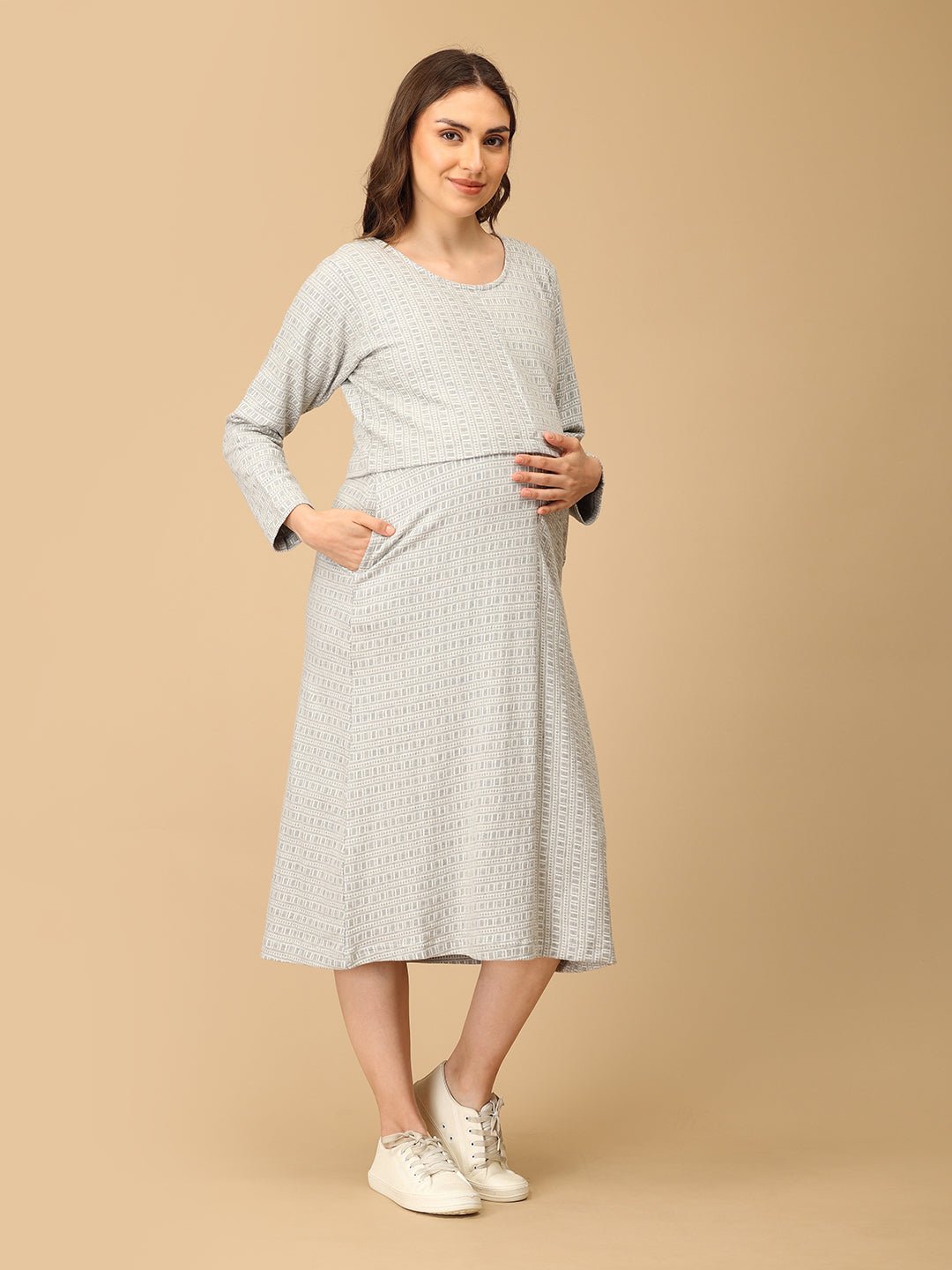 Elegant maternity and nursing dress with shrug in soft grey pattern, designed for pregnant and breastfeeding moms. Made from breathable fabric with hidden zipper for easy nursing access, side pockets, and detachable shrug. Perfect for maternity wear India, feeding dresses online, and everyday comfort with effortless style.