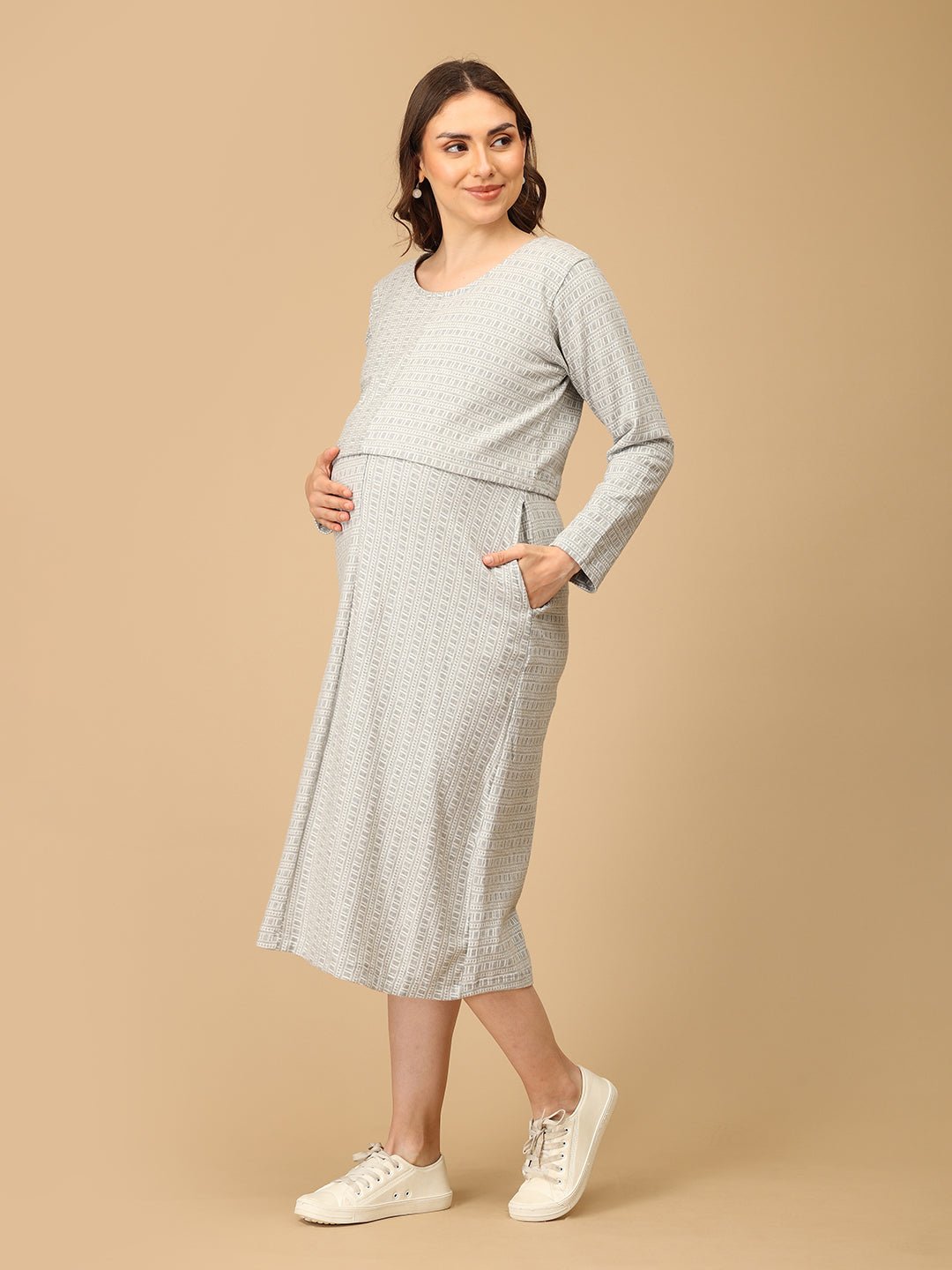 Elegant maternity and nursing dress with shrug in soft grey pattern, designed for pregnant and breastfeeding moms. Made from breathable fabric with hidden zipper for easy nursing access, side pockets, and detachable shrug. Perfect for maternity wear India, feeding dresses online, and everyday comfort with effortless style.
