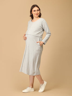Elegant maternity and nursing dress with shrug in soft grey pattern, designed for pregnant and breastfeeding moms. Made from breathable fabric with hidden zipper for easy nursing access, side pockets, and detachable shrug. Perfect for maternity wear India, feeding dresses online, and everyday comfort with effortless style.