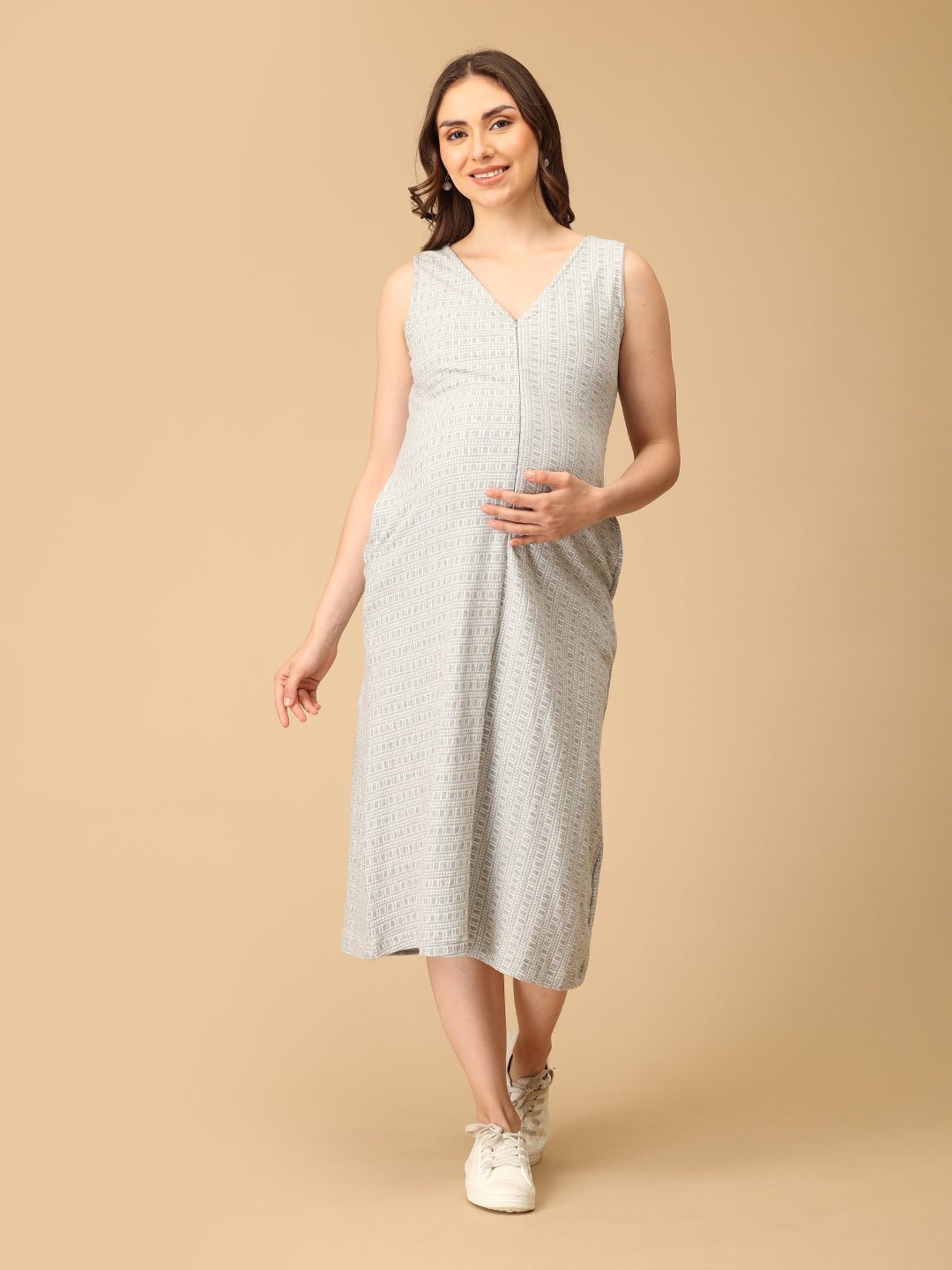 Elegant maternity and nursing dress with shrug in soft grey pattern, designed for pregnant and breastfeeding moms. Made from breathable fabric with hidden zipper for easy nursing access, side pockets, and detachable shrug. Perfect for maternity wear India, feeding dresses online, and everyday comfort with effortless style.