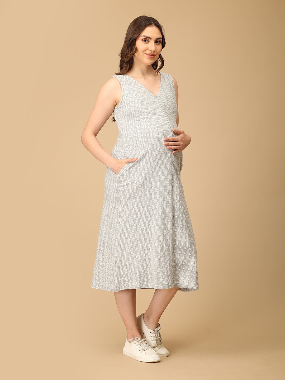 Elegant maternity and nursing dress with shrug in soft grey pattern, designed for pregnant and breastfeeding moms. Made from breathable fabric with hidden zipper for easy nursing access, side pockets, and detachable shrug. Perfect for maternity wear India, feeding dresses online, and everyday comfort with effortless style.