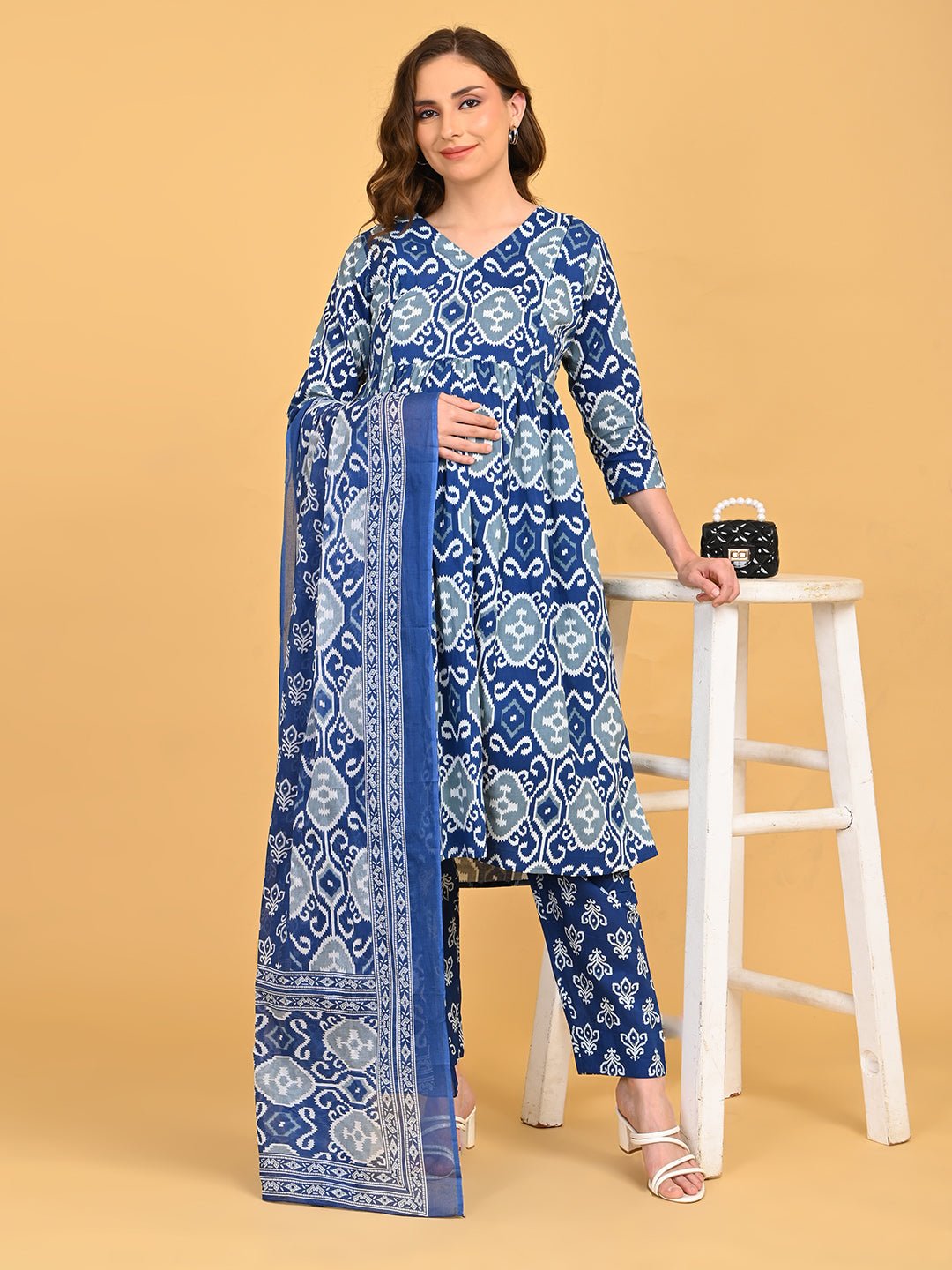 Model wearing Indigo Mode Maternity and Nursing Kurta Set With Dupatta featuring blue and grey ikat print with matching dupatta.