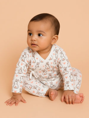 Picture of a baby wearing jabla style romper with rabbit designs from the mom store