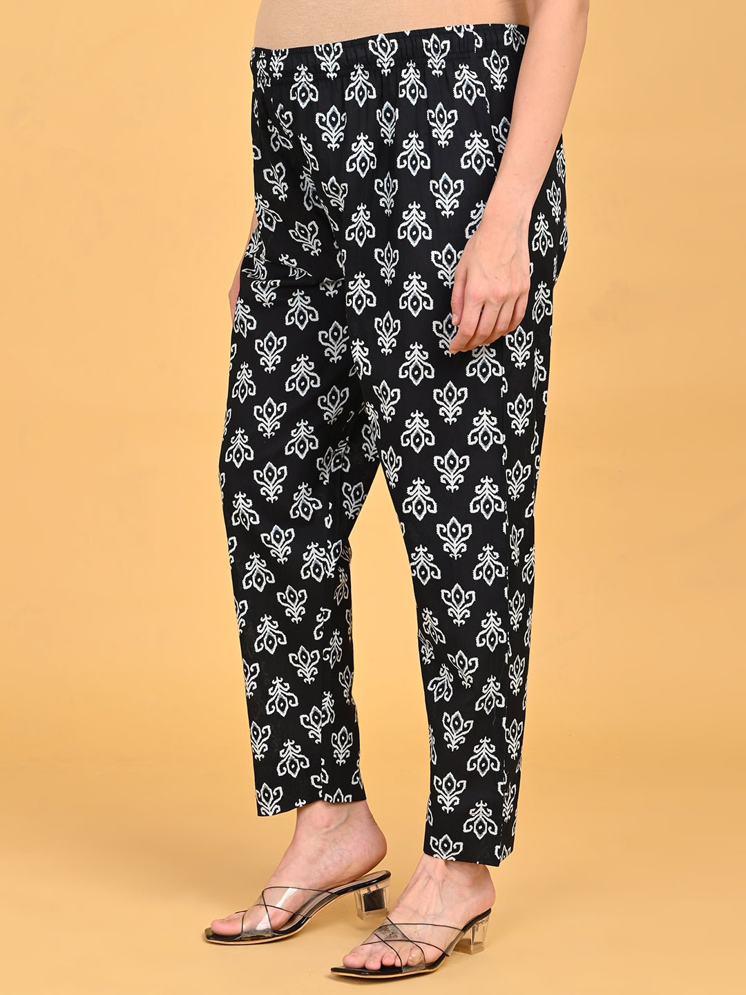 Side view of straight-fit printed pants from Ivory Shadow Maternity and Nursing Kurta Set With Dupatta.