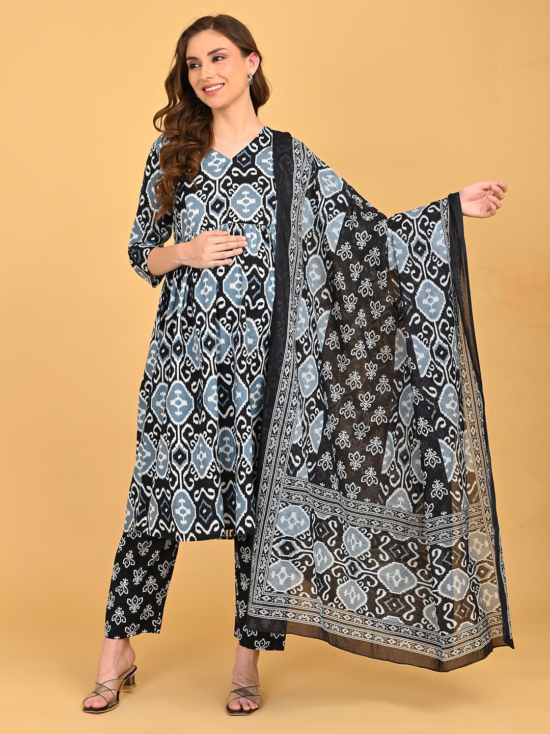 Model wearing Ivory Shadow Maternity and Nursing Kurta SetWith Dupatta featuring blue and grey ikat print with matching dupatta.