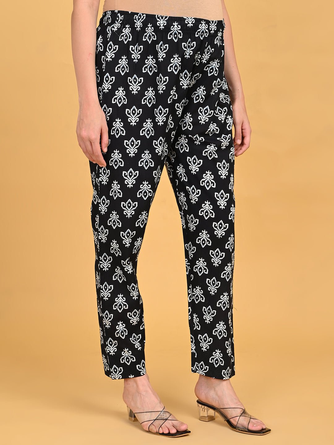 Side view of straight-fit printed pants from Ivory Shadow Maternity and Nursing Kurta Set With Dupatta.