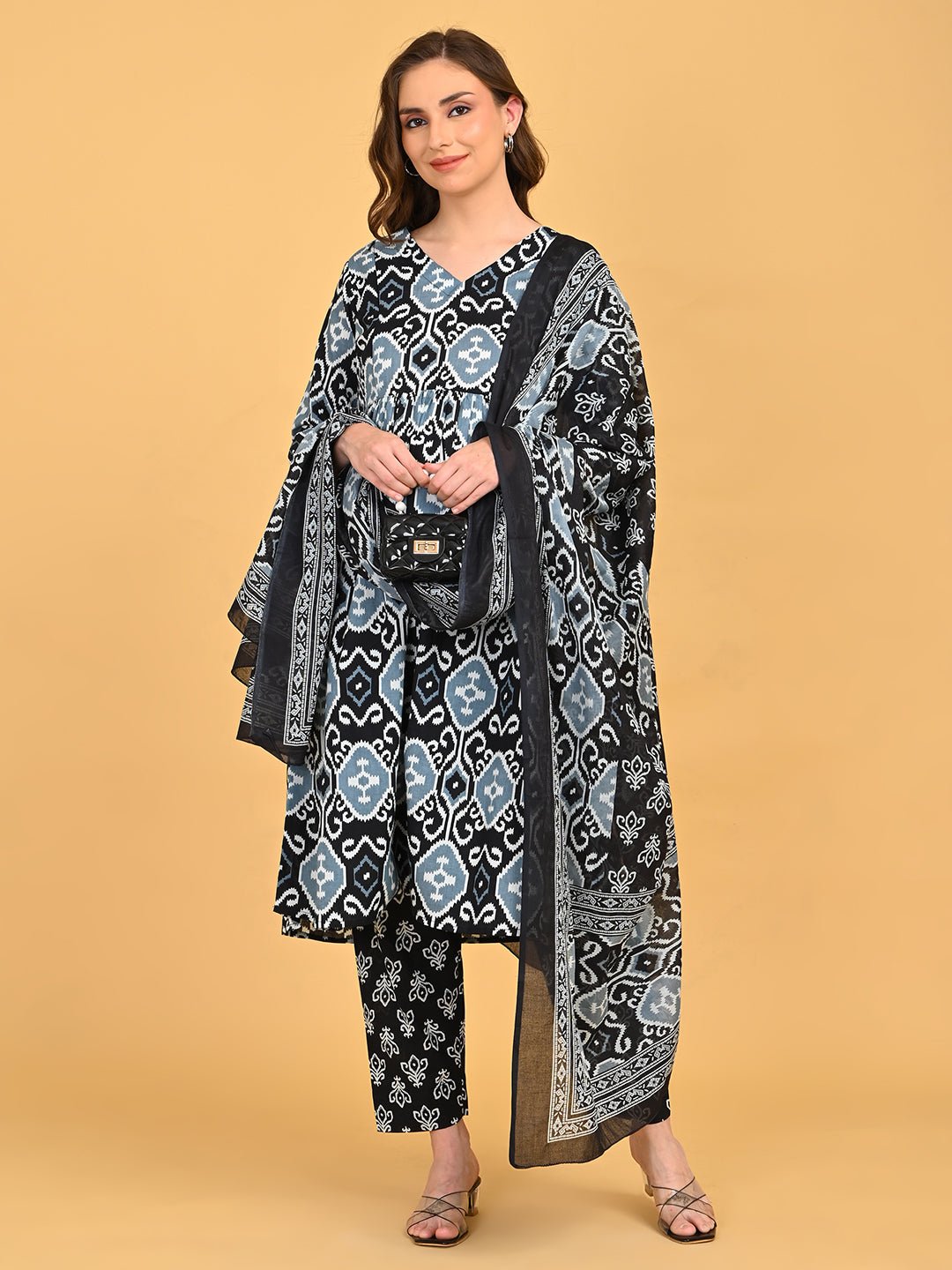 Ivory Shadow Maternity and Nursing Kurta Set With Dupatta styled with printed pants and sheer bordered dupatta.