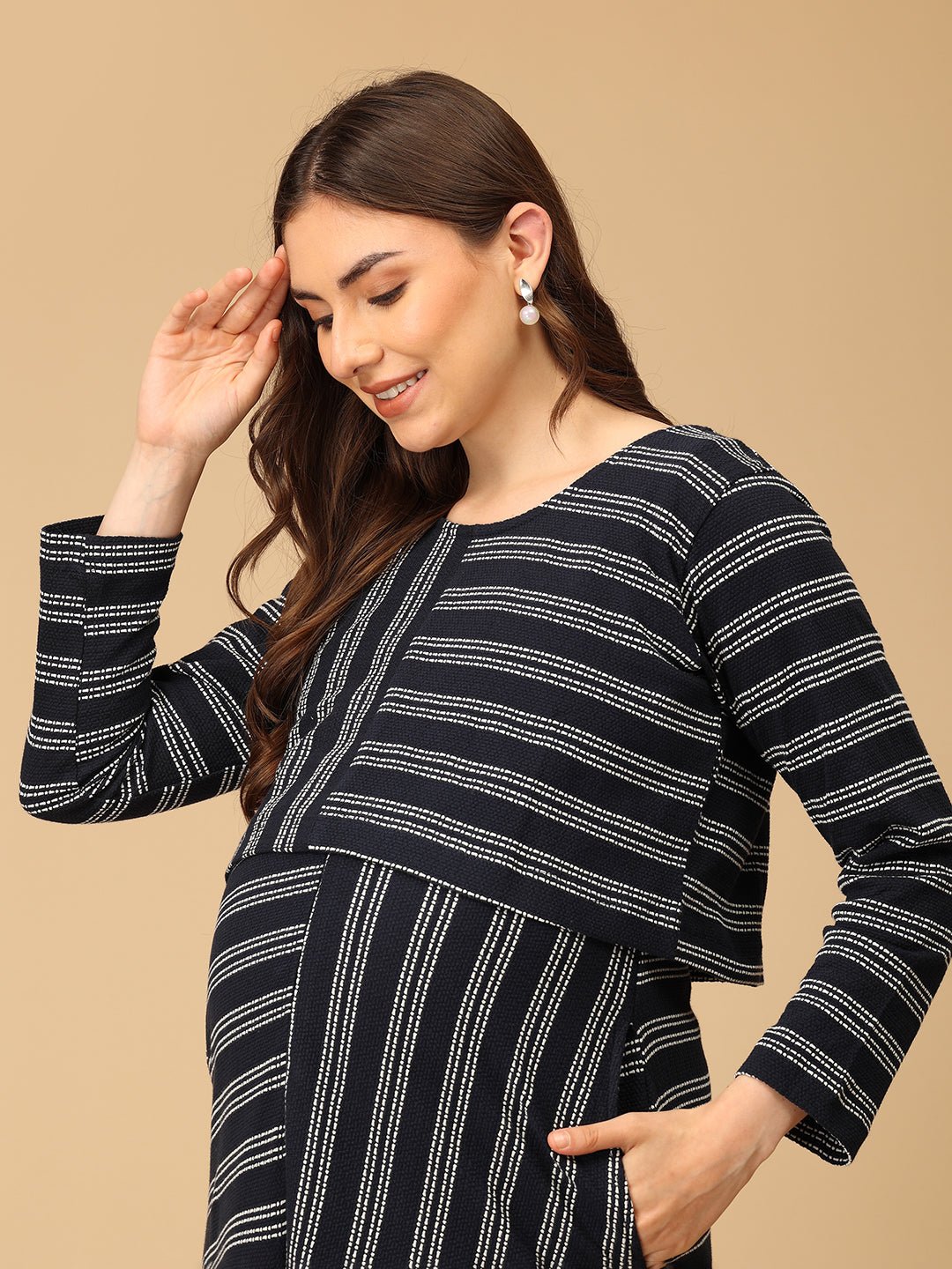 Trendy maternity and nursing dress with shrug in navy blue and white stripes, perfect for pregnant and new moms. Made from soft, breathable fabric with hidden zipper nursing access and side pockets. Ideal for maternity wear India, feeding dress online, and postpartum fashion—combining comfort, style, and functionality for everyday wear.
