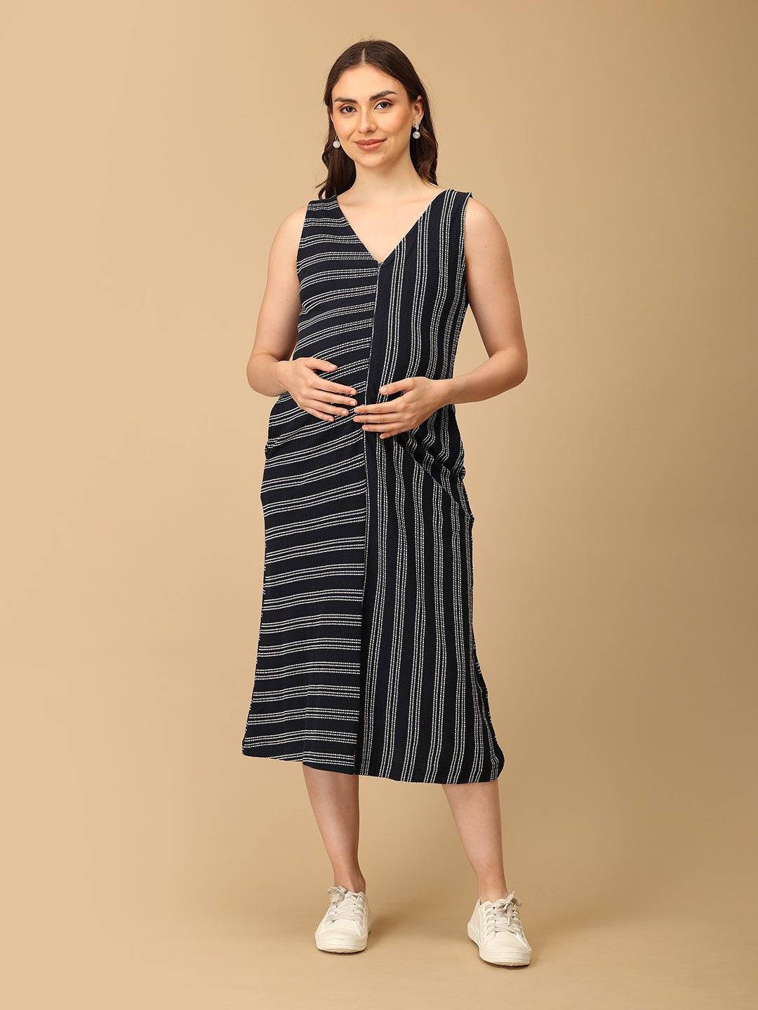 Trendy maternity and nursing dress with shrug in navy blue and white stripes, perfect for pregnant and new moms. Made from soft, breathable fabric with hidden zipper nursing access and side pockets. Ideal for maternity wear India, feeding dress online, and postpartum fashion—combining comfort, style, and functionality for everyday wear.