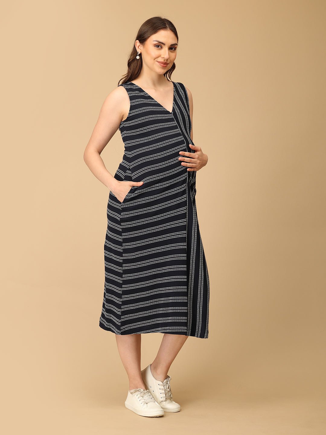 Trendy maternity and nursing dress with shrug in navy blue and white stripes, perfect for pregnant and new moms. Made from soft, breathable fabric with hidden zipper nursing access and side pockets. Ideal for maternity wear India, feeding dress online, and postpartum fashion—combining comfort, style, and functionality for everyday wear.