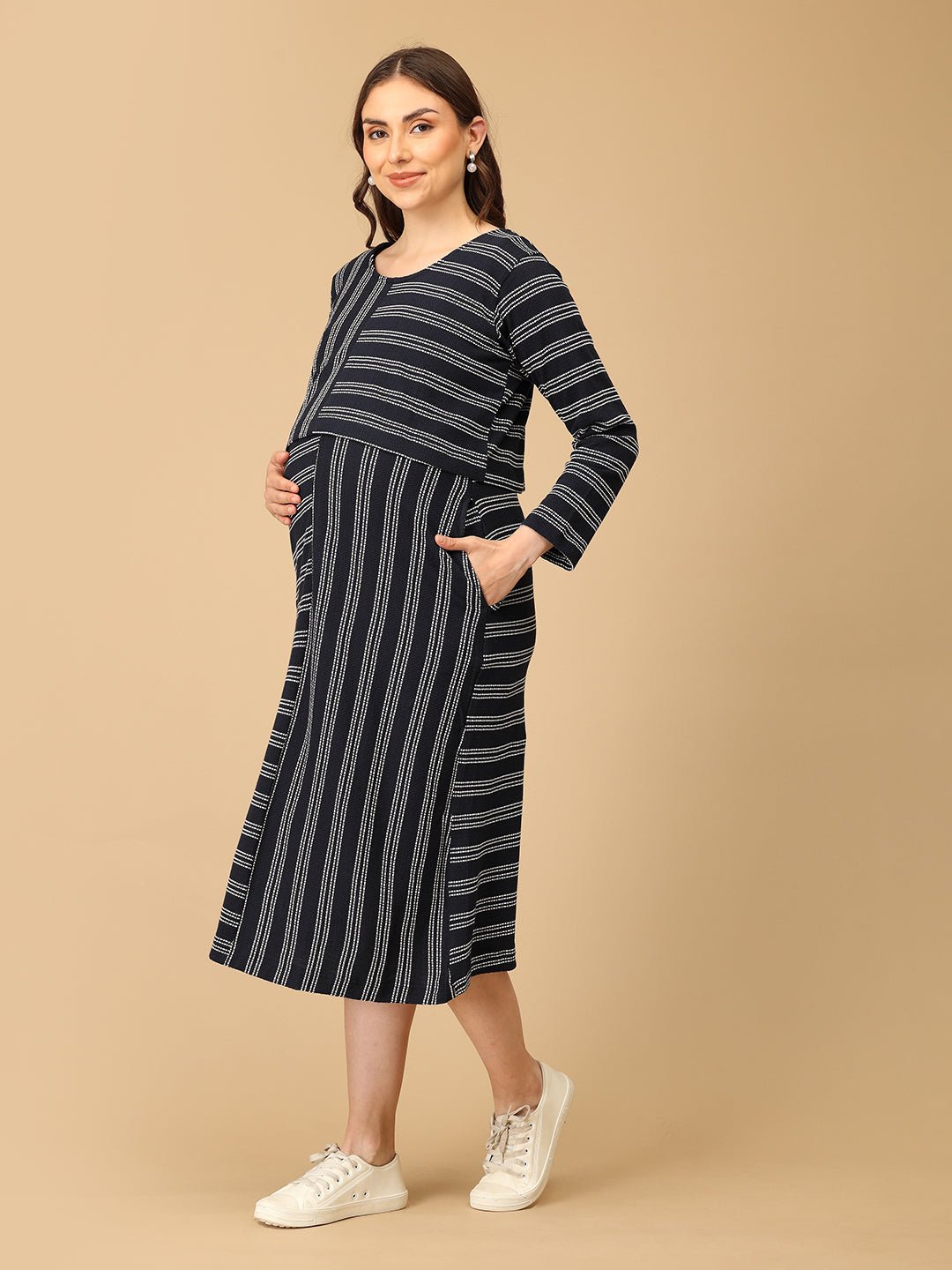 Trendy maternity and nursing dress with shrug in navy blue and white stripes, perfect for pregnant and new moms. Made from soft, breathable fabric with hidden zipper nursing access and side pockets. Ideal for maternity wear India, feeding dress online, and postpartum fashion—combining comfort, style, and functionality for everyday wear.
