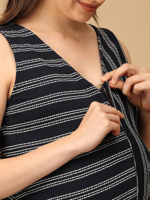 Trendy maternity and nursing dress with shrug in navy blue and white stripes, perfect for pregnant and new moms. Made from soft, breathable fabric with hidden zipper nursing access and side pockets. Ideal for maternity wear India, feeding dress online, and postpartum fashion‚Äîcombining comfort, style, and functionality for everyday wear.