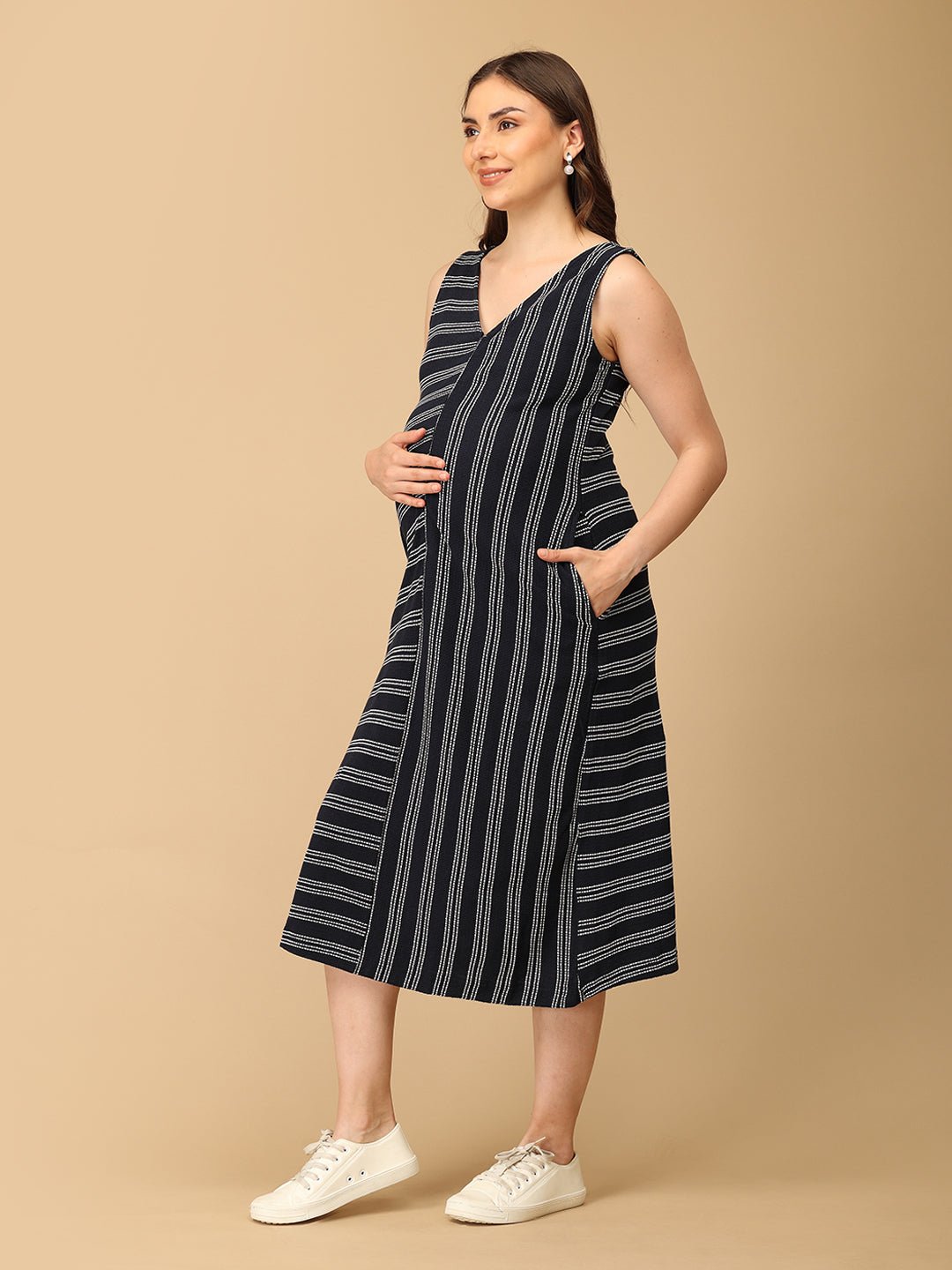 Trendy maternity and nursing dress with shrug in navy blue and white stripes, perfect for pregnant and new moms. Made from soft, breathable fabric with hidden zipper nursing access and side pockets. Ideal for maternity wear India, feeding dress online, and postpartum fashion—combining comfort, style, and functionality for everyday wear.