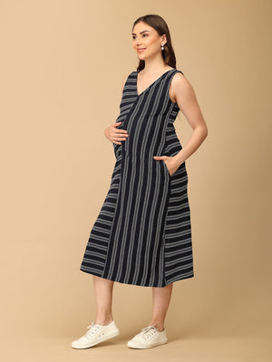 Trendy maternity and nursing dress with shrug in navy blue and white stripes, perfect for pregnant and new moms. Made from soft, breathable fabric with hidden zipper nursing access and side pockets. Ideal for maternity wear India, feeding dress online, and postpartum fashion‚Äîcombining comfort, style, and functionality for everyday wear.
