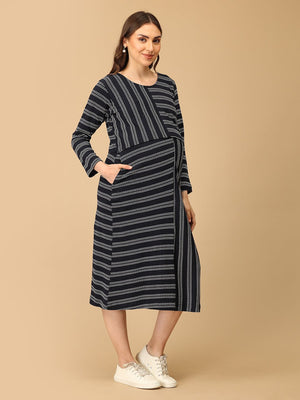 Trendy maternity and nursing dress with shrug in navy blue and white stripes, perfect for pregnant and new moms. Made from soft, breathable fabric with hidden zipper nursing access and side pockets. Ideal for maternity wear India, feeding dress online, and postpartum fashion‚Äîcombining comfort, style, and functionality for everyday wear.