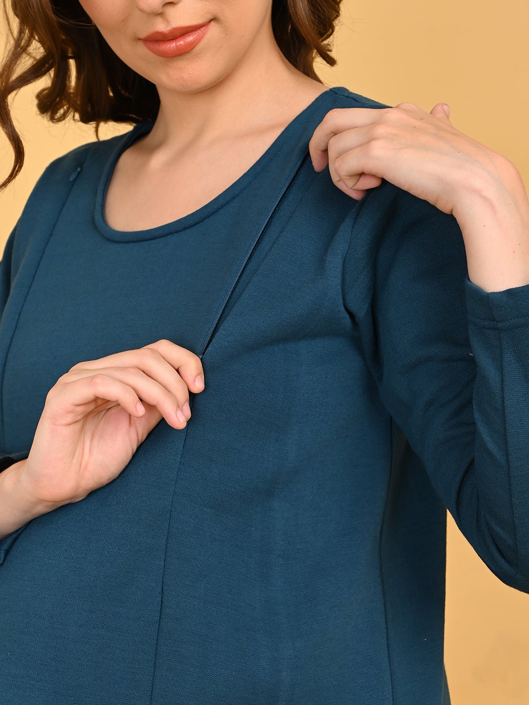 Close-up of hidden side zipper on Keepin’ It Teal maternity top for easy nursing access.