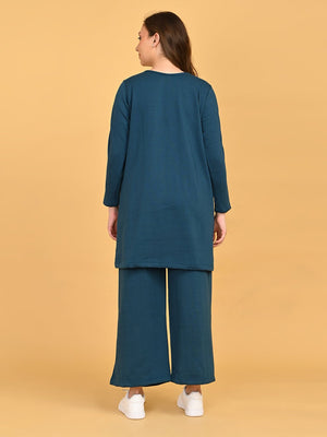 Back view of Keepin‚Äô It Teal maternity and nursing loungewear set featuring long tunic top and wide-leg pants.