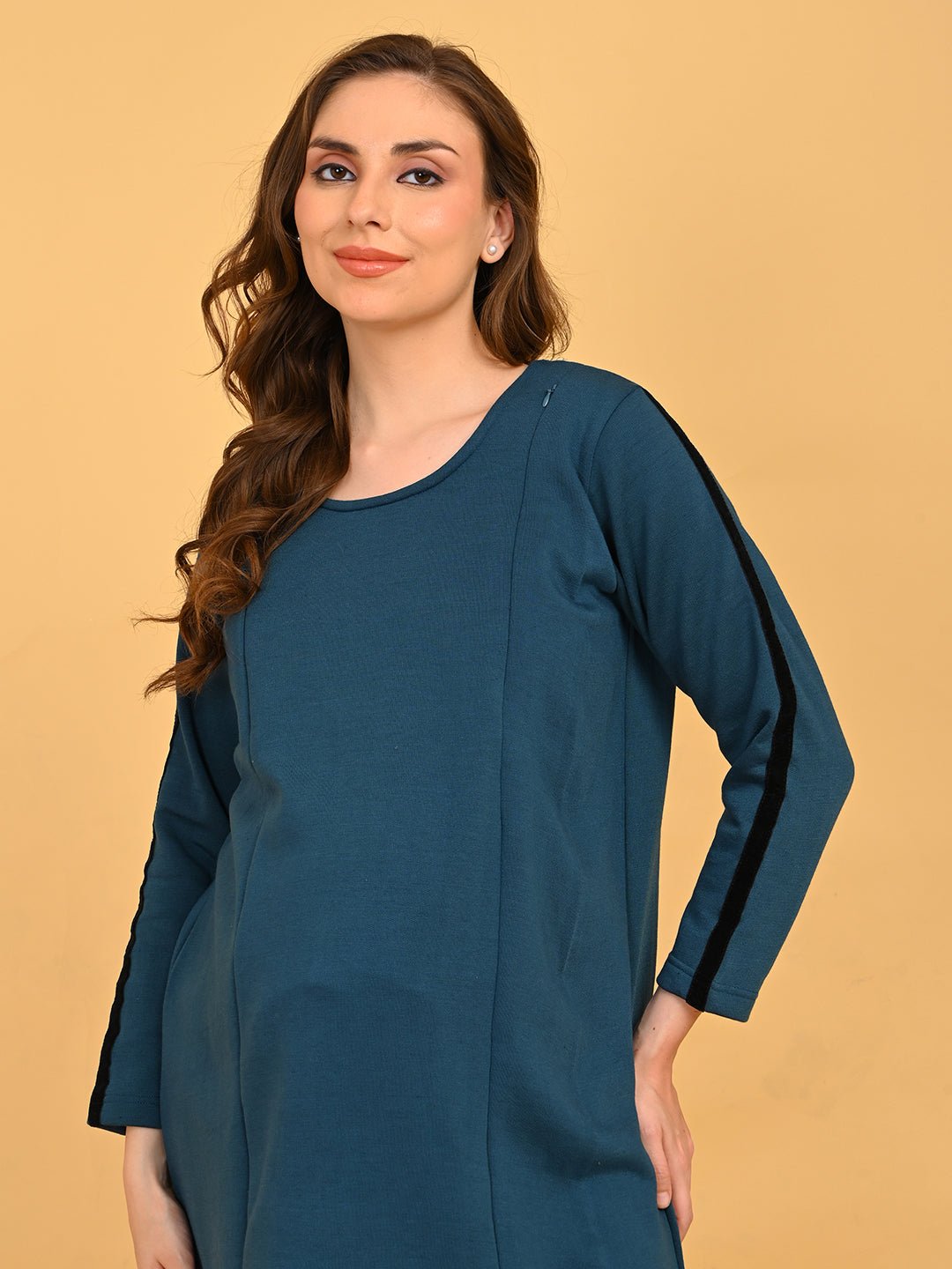 Pregnant model posing in Keepin’ It Teal maternity and nursing loungewear set with relaxed fit.