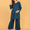Pregnant model posing in Keepin’ It Teal maternity and nursing loungewear set with relaxed fit.