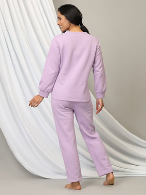 Pregnant lady wearing Lavender Lush Maternity and Nursing Pajama Loungewear Set from the Mom store facing backwards