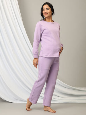 Pregnant lady wearing Lavender Lush Maternity and Nursing Pajama Loungewear Set from the Mom store with a hand on her belly