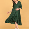 Leaf Me Breathless Maternity Wrap Dress full-length twirl pose showcasing layered ruffle hem and flowy silhouette.