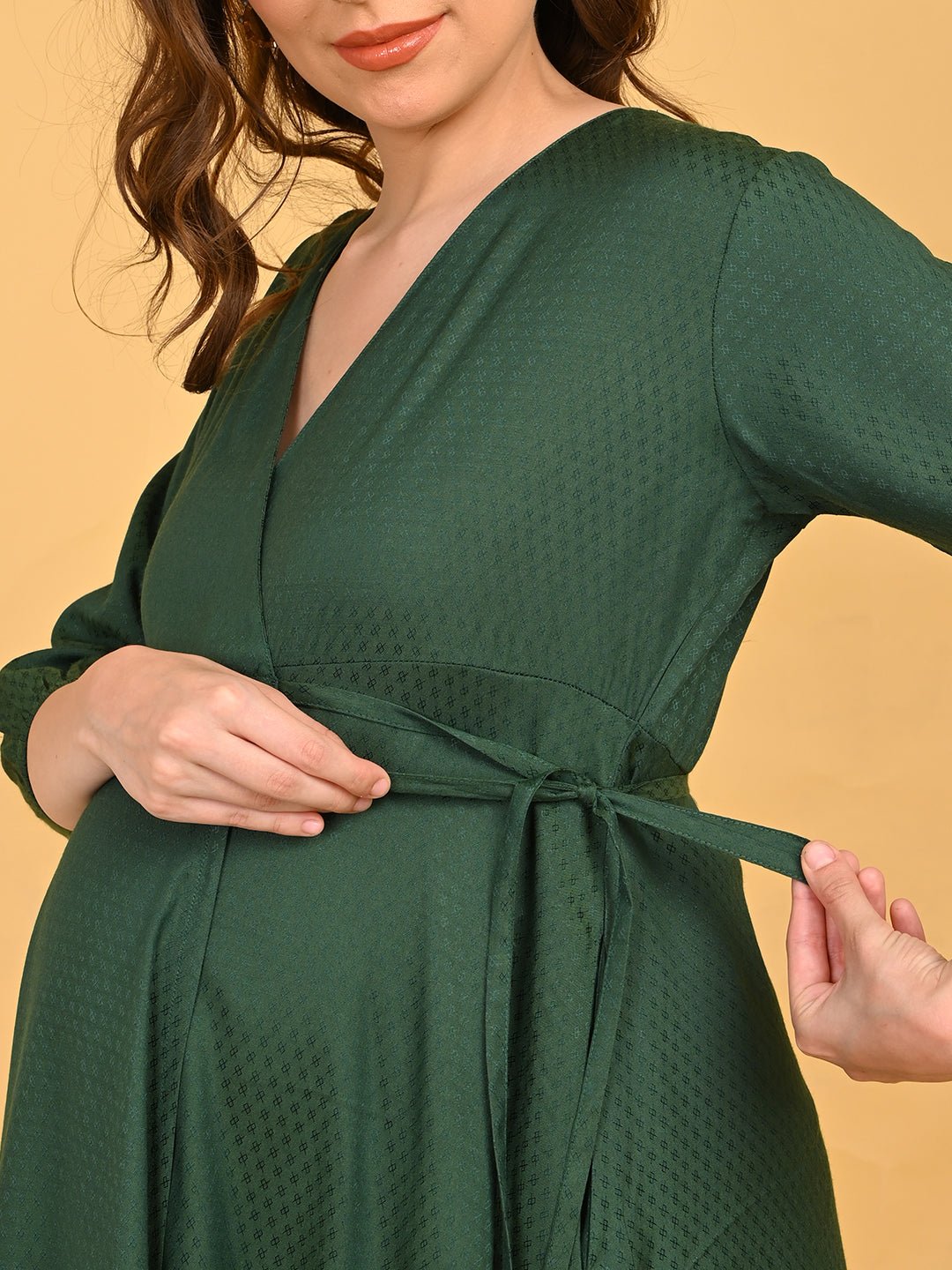 Leaf Me Breathless Maternity Wrap Dress close-up of adjustable side waist tie being fastened.