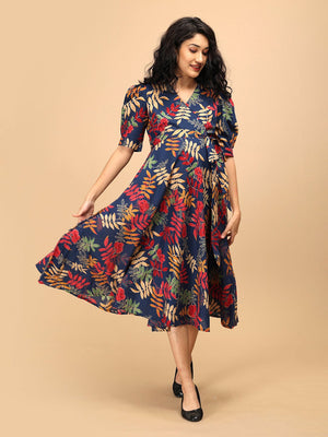 Front view of a navy blue floral maternity and nursing wrap dress with a wide, flowing hem.