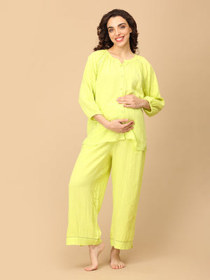 Playful pose by model wearing Lime - o - Clock Maternity and Nursing Nightwear Set from the mom store touching her belly